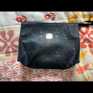 MCM Vinyl Clutch with Pebbled Leather Interior